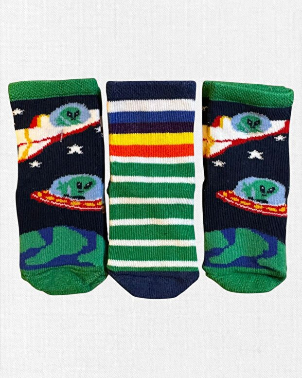 Three pairs of socks with space-themed designs on a white background